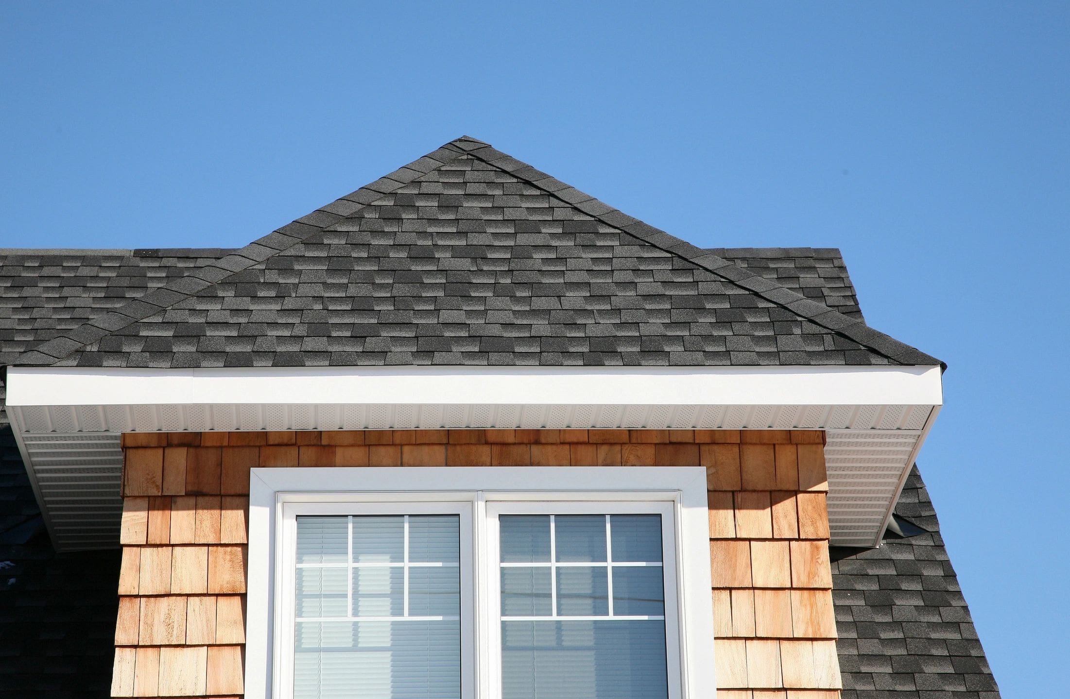 A house with a roof that has been angled to the side.